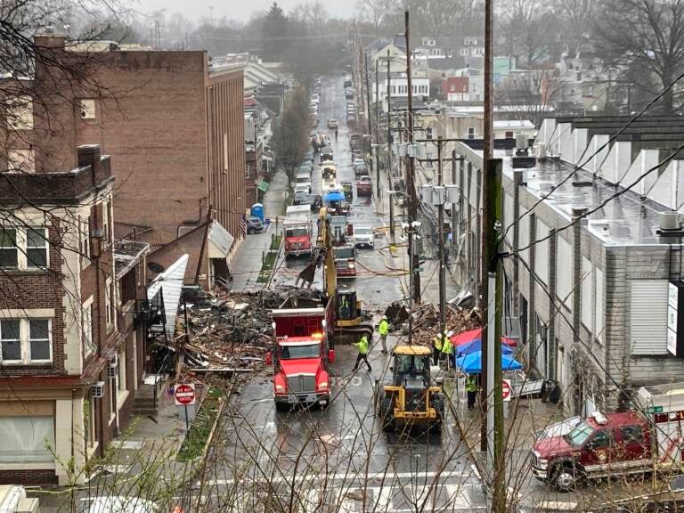 Emergency responders and heavy equipment are seen at the site of a deadly explosion at a chocolate factory in West Reading, Pennsylvania.