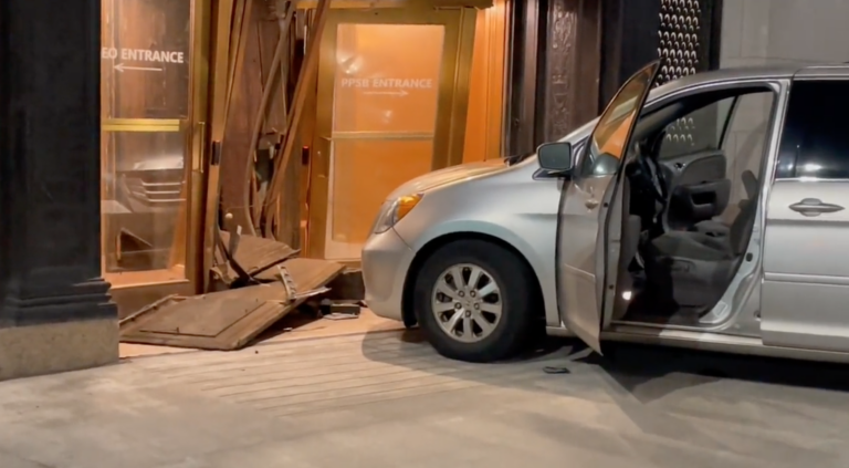 A minivan is seen after a driver crashed into the front of Philadelphia police headquarters