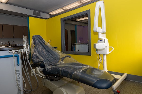 An Operational room with a dental chair in center, x-ray unit (right) and dental unit (left) at the William D. Kelley School in Brewerytown