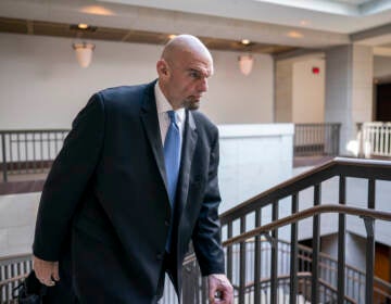 Fetterman walks in the Capitol.