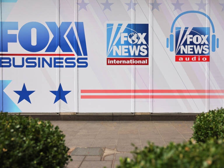 The logos for Fox programs are displayed on the News Corp. building