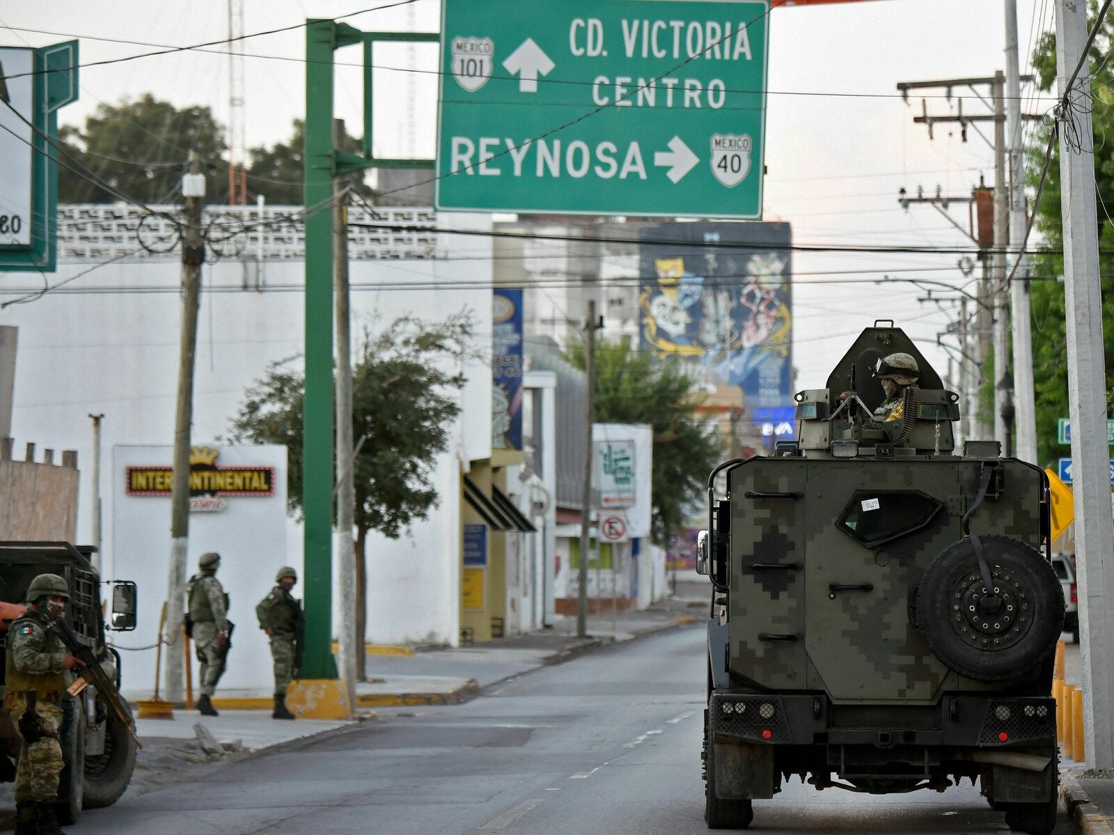 Members of the National Guard wait for members of the General Attorney¨s Office to leave in a caravan with relatives of disappeared persons to a property called 