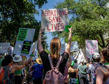 Texas abortion rights supporters march near the Austin Convention Center in May of 2022. A new lawsuit filed in state court asks a judge to clarify medical exemptions in the state's abortion bans. (Brandon Bell/Getty Images)