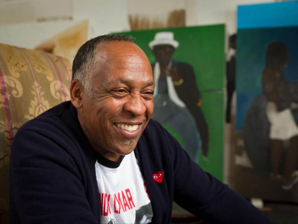 Henry Taylor smiles in a close-up portrait