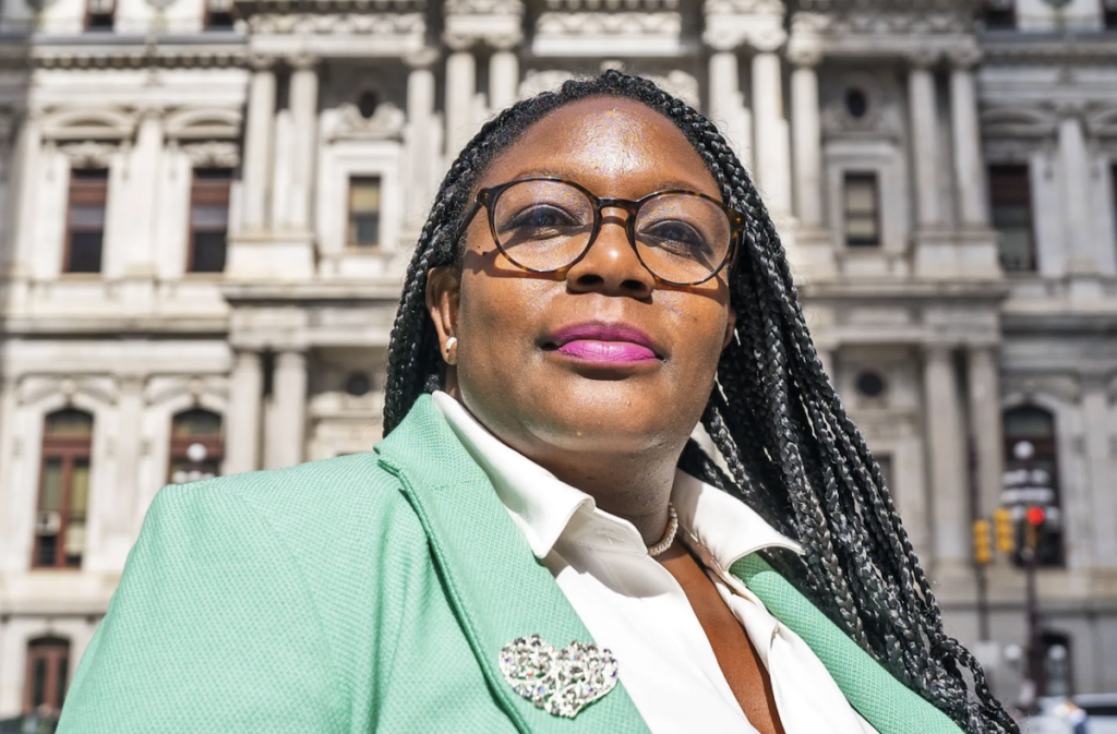 Kendra Brooks posing outside in front of City Hall