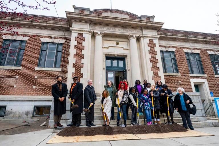 People with shovels at a groundbreaking event