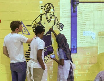 Andrew Hamilton students in 2019, working on the Shira Walinsky mural to brighten their gym