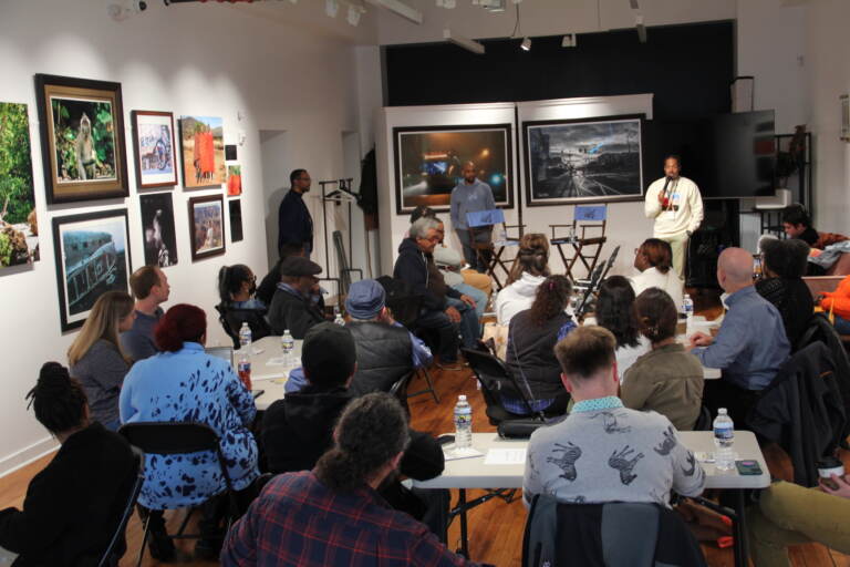 Dozens gathered to discuss the hot button issue at the Ubuntu Fine Art Gallery. (Cory Sharber/WHYY)