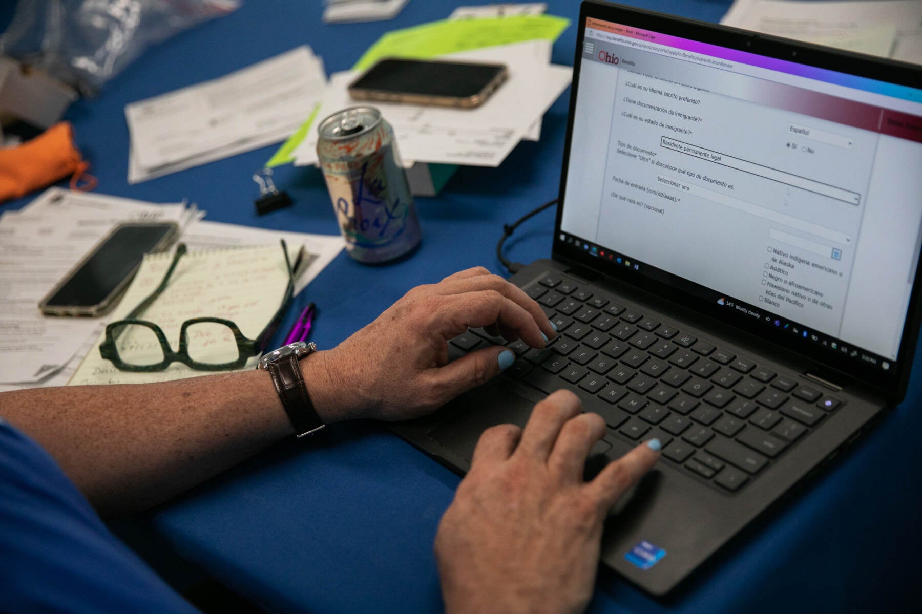 Samuel Camacho, a health insurance navigator with the Universal Health Care Action Network of Ohio, assists people in enrolling for or renewing Medicaid