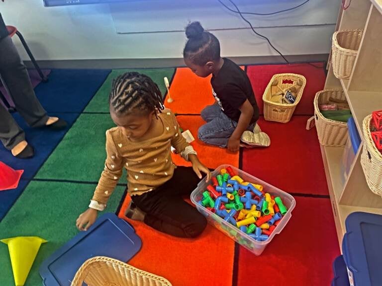Lotus Barnes (foreground) and Daneri Owens enjoy play time at the Southbridge cente