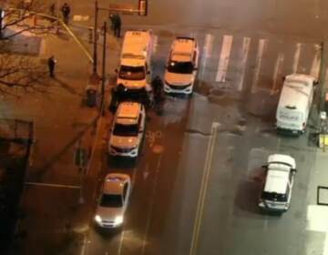 An aerial view of police cars at Broad and Snyder at night.