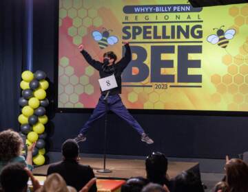 WHYY-Billy Penn Regional Spelling Bee 2023 winner Jack Jiang leaps into the air after winning first place