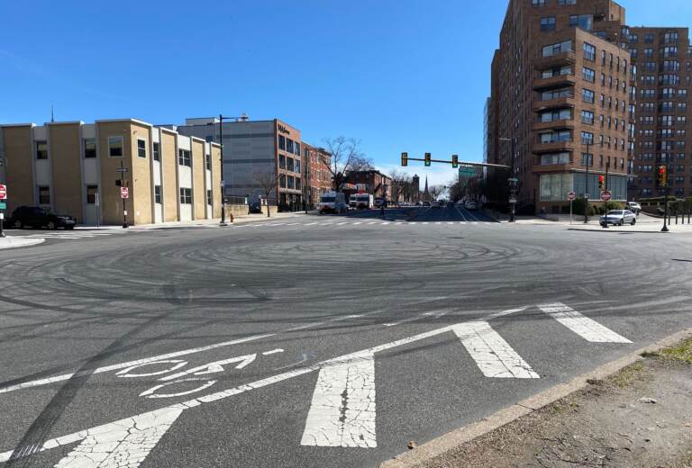 Clear drifting marks shown on the road at the  intersection of Spring Garden and N 23rd streets. (Ella Lathan/WHYY)