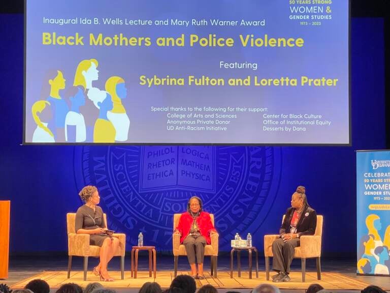 Sybrina Fulton, Loretta Prater, and a moderator sit onstage.