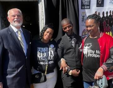 Byron Cotter, Michelle Anne Simmons, Marcus Pearson and Delia Avery pose for a photo outdoors.