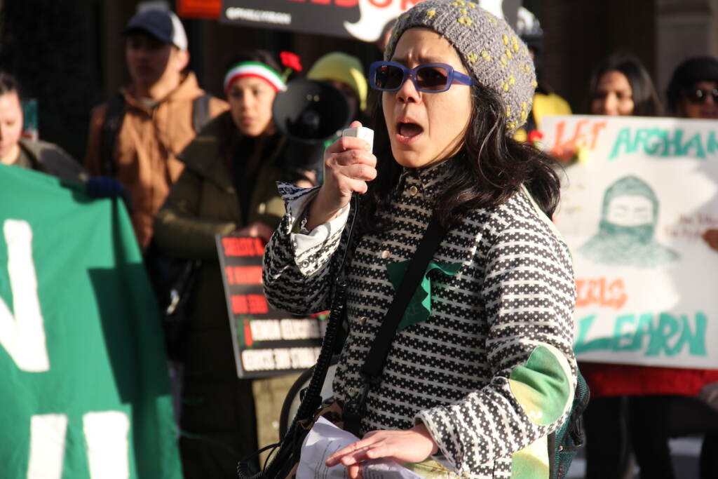 Koyuki Chen speaks into a microphone.