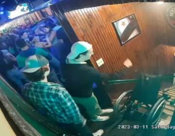 Security camera footage of Mercyhurst University student Carson Briere pushing a wheelchair down a flight of stairs at a bar.