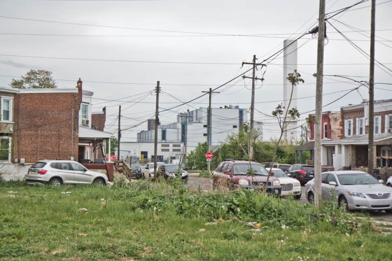 An empty lot on a residential street.