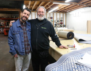 Father and son in a workshop.