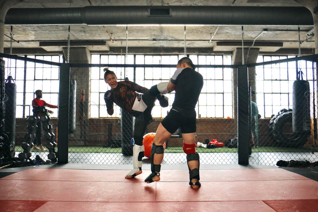 DeAnna Bennett spars with teammate Eugene Hong during a practice at Marquez MMA Gym