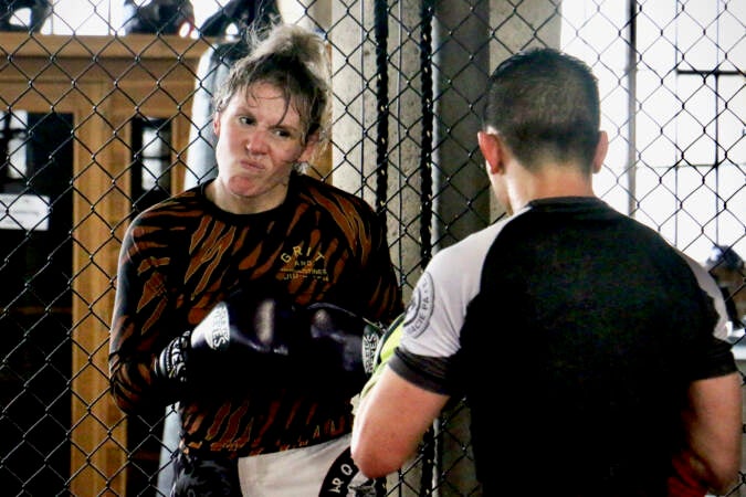 DeAnna Bennett squares off against teammate Eugene Hong during a practice bout at Marquez MMA Gym