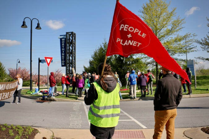 Activists gather at the Brennan Boulevard entrance to Vanguard offices near Malvern, Pa. (Emma Lee/WHYY)