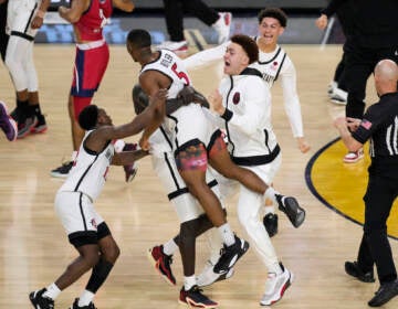 San Diego State guard Lamont Butler (5) celebrates with teammates after hitting the winning basket against Florida Atlantic during the second half of a Final Four college basketball game in the NCAA Tournament on Saturday, April 1, 2023, in Houston