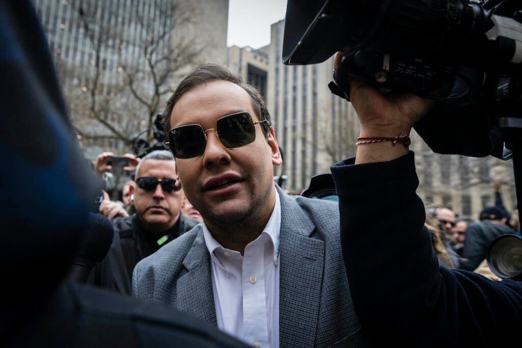 Rep. George Santos, R-N.Y., walks past the criminal courthouse at 100 Center Street in New York on Tuesday, April 4, 2023