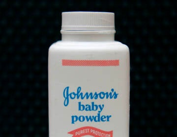 A bottle of Johnson's baby powder is displayed