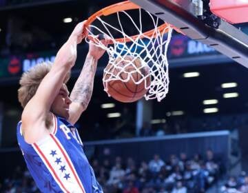 Philadelphia 76ers guard Mac McClung (9) dunks against the Brooklyn Nets during the first half of an NBA basketball game