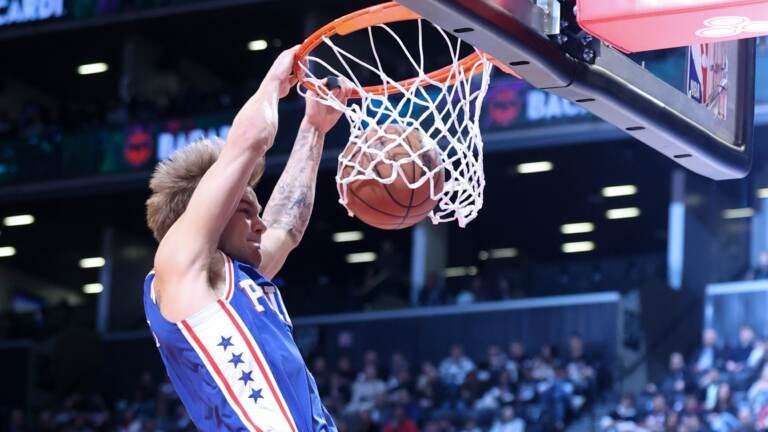Philadelphia 76ers guard Mac McClung (9) dunks against the Brooklyn Nets during the first half of an NBA basketball game