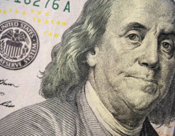 The likeness of Benjamin Franklin is seen on a U.S. $100 bill, Wednesday, Feb. 22, 2023, in Marple Township