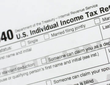 A portion of the 1040 U.S. Individual Income Tax Return form is shown