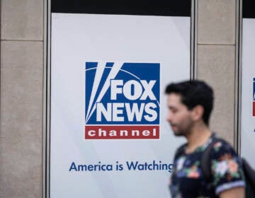 A person walks past the Fox News Headquarters in New York