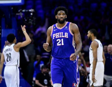Philadelphia 76ers' Joel Embiid reacts after a score by Tobias Harris in the first half during Game 2 in the first round of the NBA basketball playoffs against the Brooklyn Nets