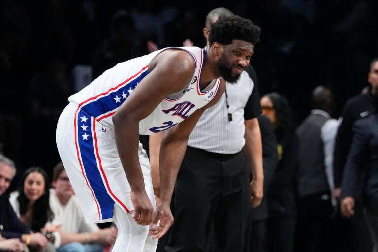 Philadelphia 76ers' Joel Embiid reacts after being hurt during the second half against the Brooklyn Nets in Game 3 of an NBA basketball first-round playoff series Thursday