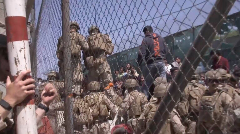 This image from a video released by the Department of Defense shows U.S. Marines at Abbey Gate before a suicide bomber struck outside Hamid Karzai International Airport on Aug. 26, 2021, in Kabul Afghanistan