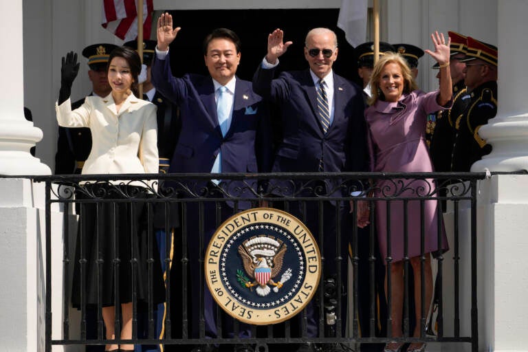 South Korea's first lady Kim Keon Hee, South Korea's President Yoon Suk Yeol​​, President Joe Biden and first lady Jill Biden wave from the Blue Room Balcony during a State Arrival Ceremony on the South Lawn of the White House Wednesday, April 26, 2023, in Washington