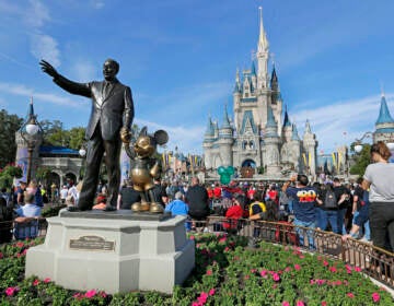 File photo: A statue of Walt Disney and Micky Mouse stands in front of the Cinderella Castle at the Magic Kingdom at Walt Disney World in Lake Buena Vista, Fla., Jan. 9, 2019