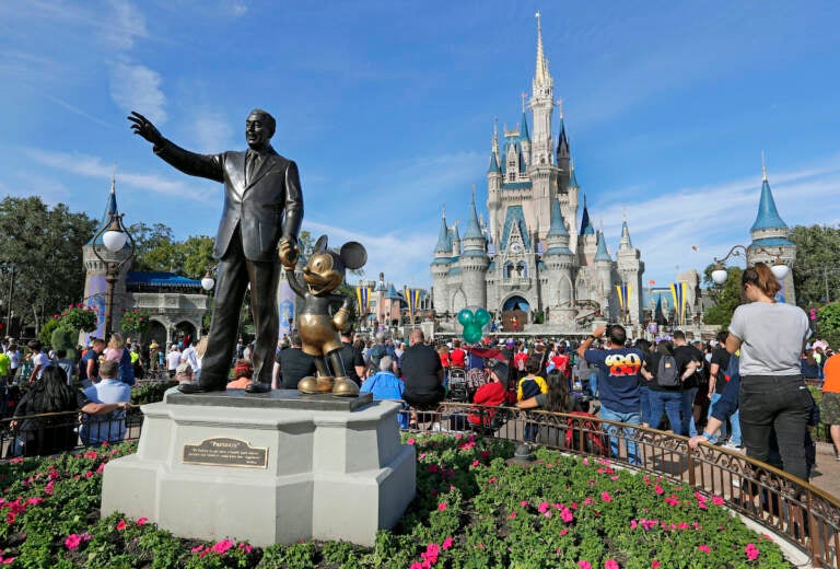 File photo: A statue of Walt Disney and Micky Mouse stands in front of the Cinderella Castle at the Magic Kingdom at Walt Disney World in Lake Buena Vista, Fla., Jan. 9, 2019