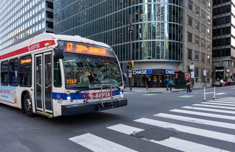 SEPTA bus passes through the intersection of N 17th and JFK Boulevard.