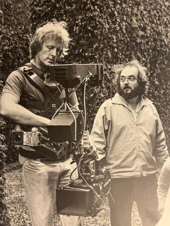 Garrett Brown (left) operates the Steadicam system on the set of ''The Shining,'' directed by Stanley Kubrick, right, and released in 1980.