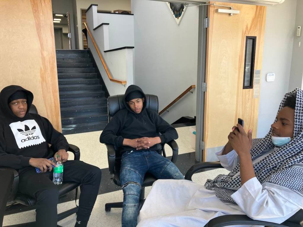 Bruce, 15, Johan, 15, and Tahjir, 16 hang out at Bait-ul-Aafiyat mosque in North Philly