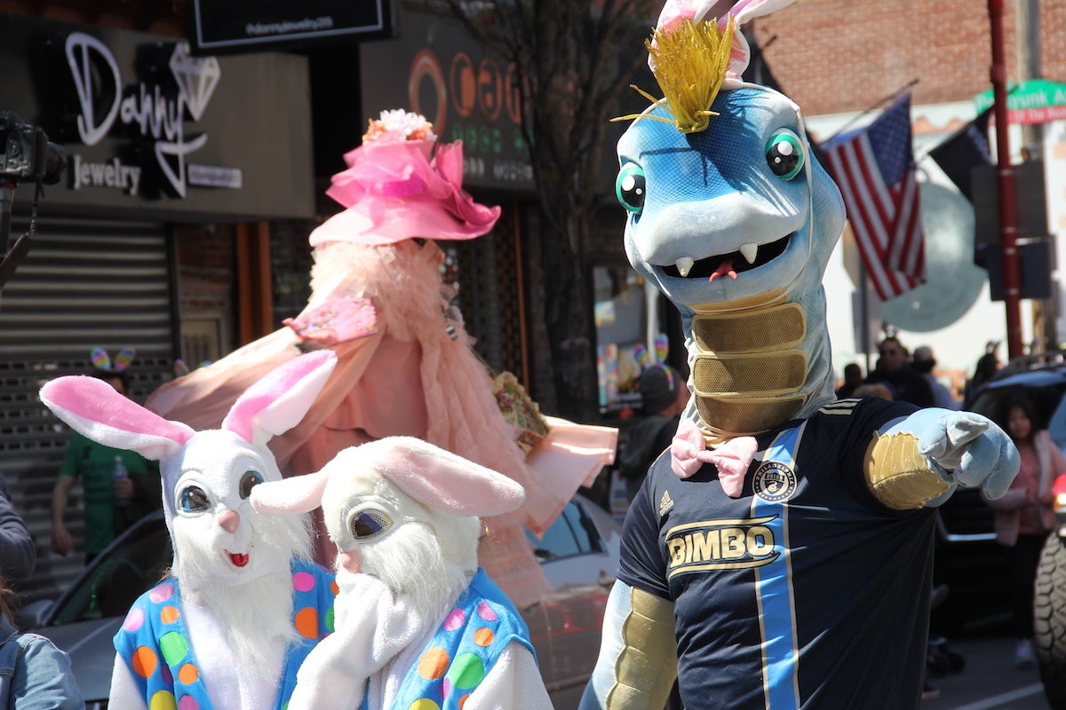 Mr. and Mrs. Cottontail, along with Phang from the Philadelphia Union welcomed parade goers on Apr. 9, 2023. (Cory Sharber/WHYY)