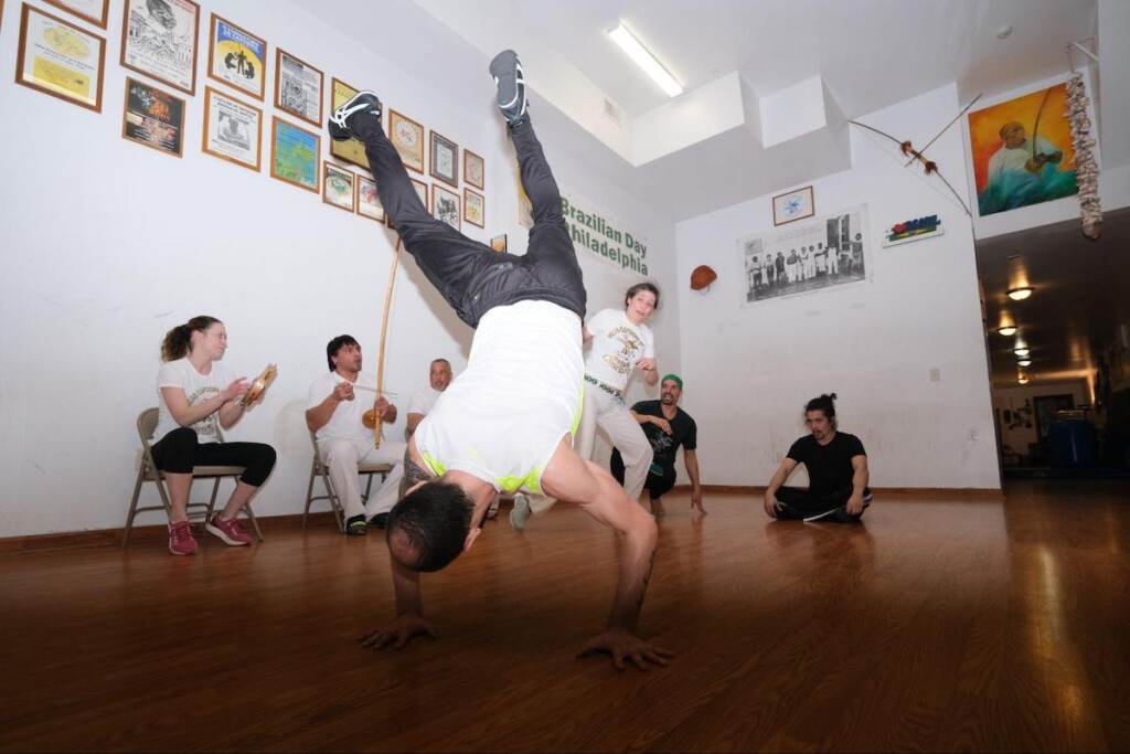 Eduardo Zancanaro does a handstand in anticipation of Hannah Wood’s next move. 