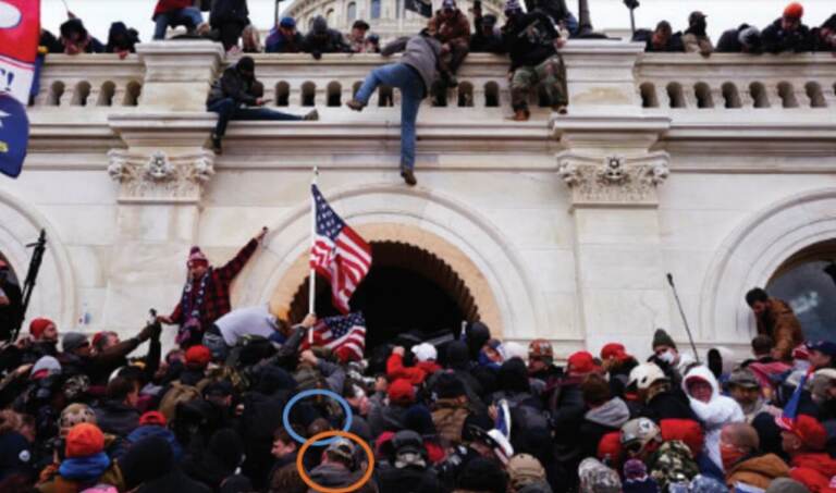 Federal prosecutors say the above photo taken on Jan. 6, 2021, shows Kepley (blue circle) and Nolf (orange circle) moving with the invading mob toward the tunnel into the Capitol. (U.S. Department of Justice)