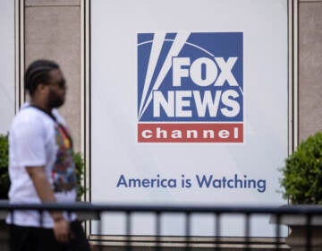A person walks past the Fox News Headquarters.