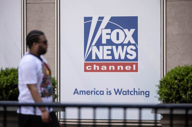 A person walks past the Fox News Headquarters.