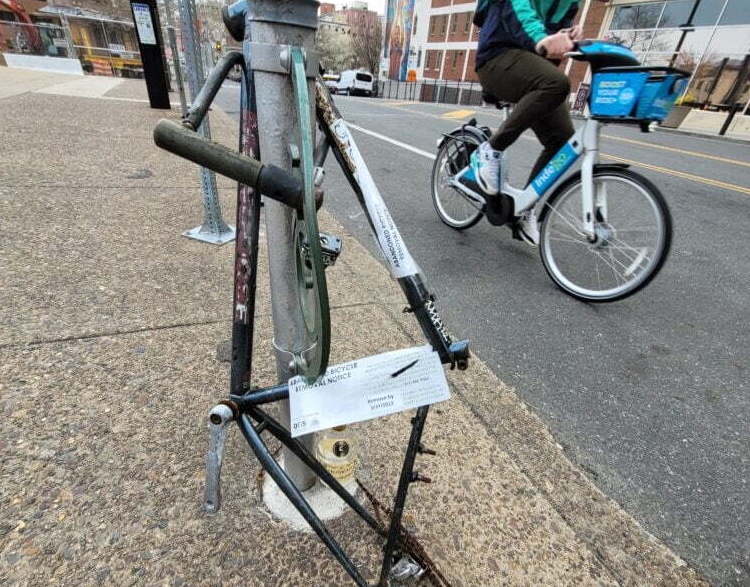 An up-close view of a bike that has a tag on it.