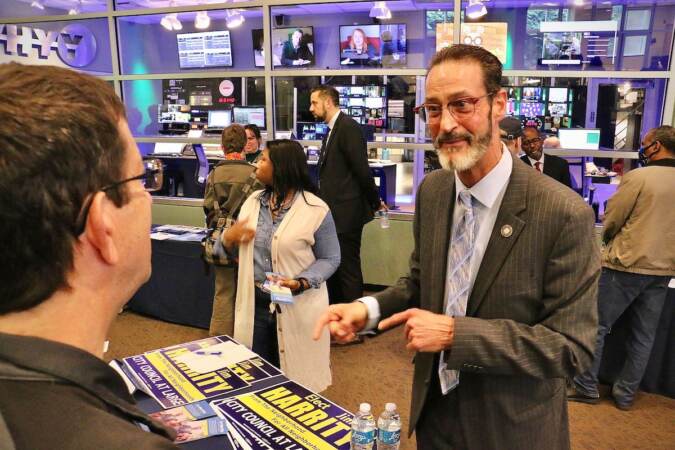 Philadelphia City Council candidate Jim Harriet talks with voters at a candidate convention hosted by WHYY. (Emma Lee/WHYY)